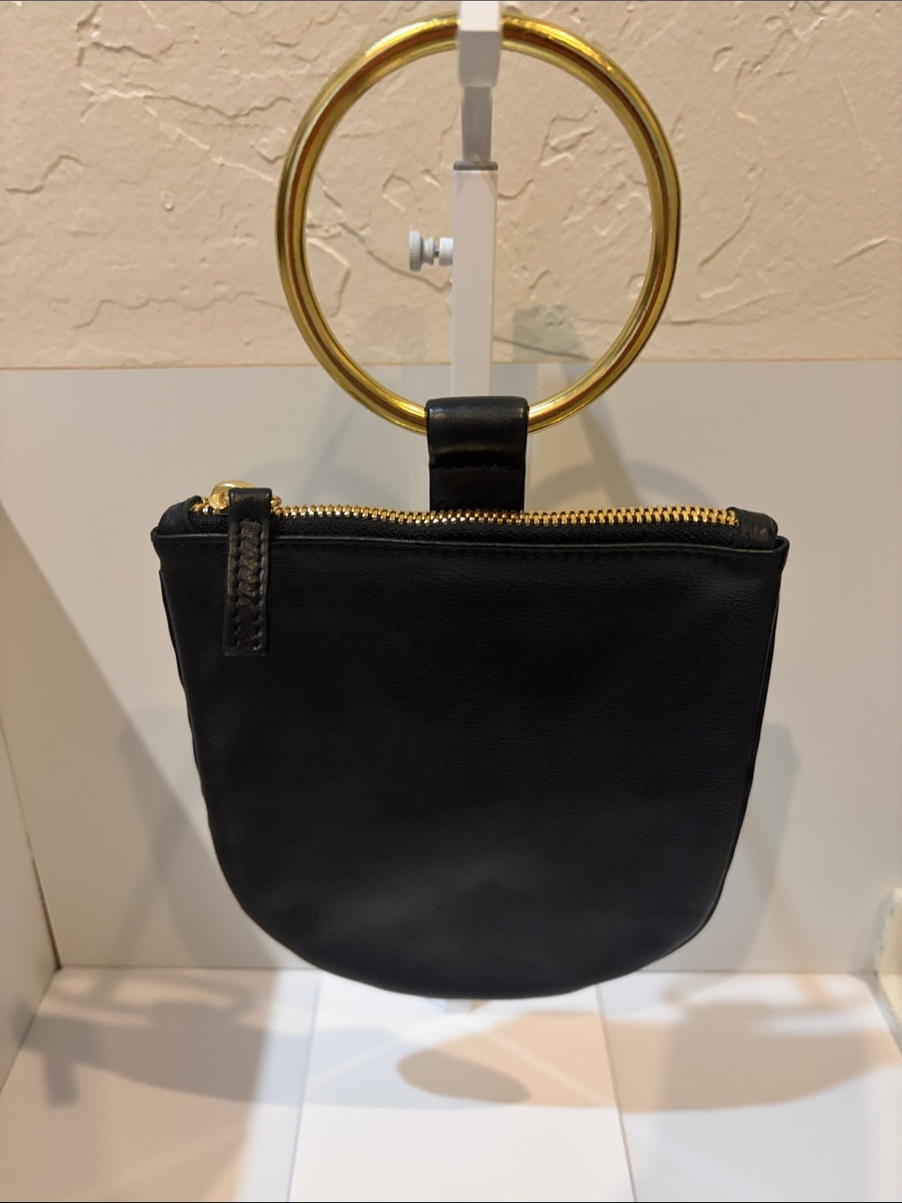 Sleek Black Leather Wristlet Clutch with Gold Ring Handle